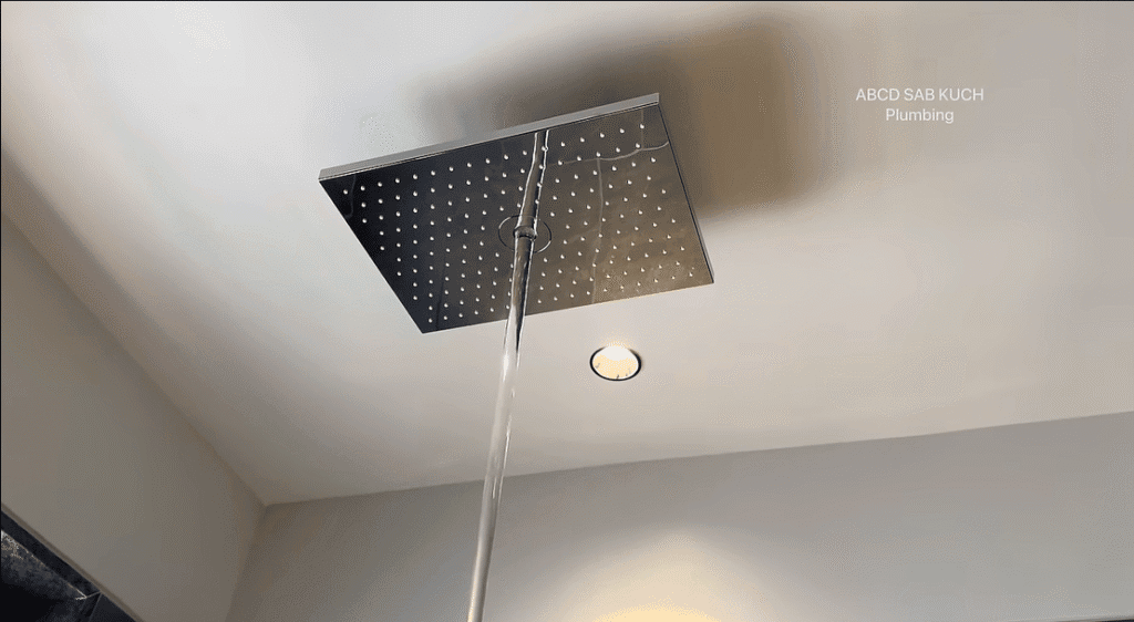 Plumber cleaning clogged drain in Dubai