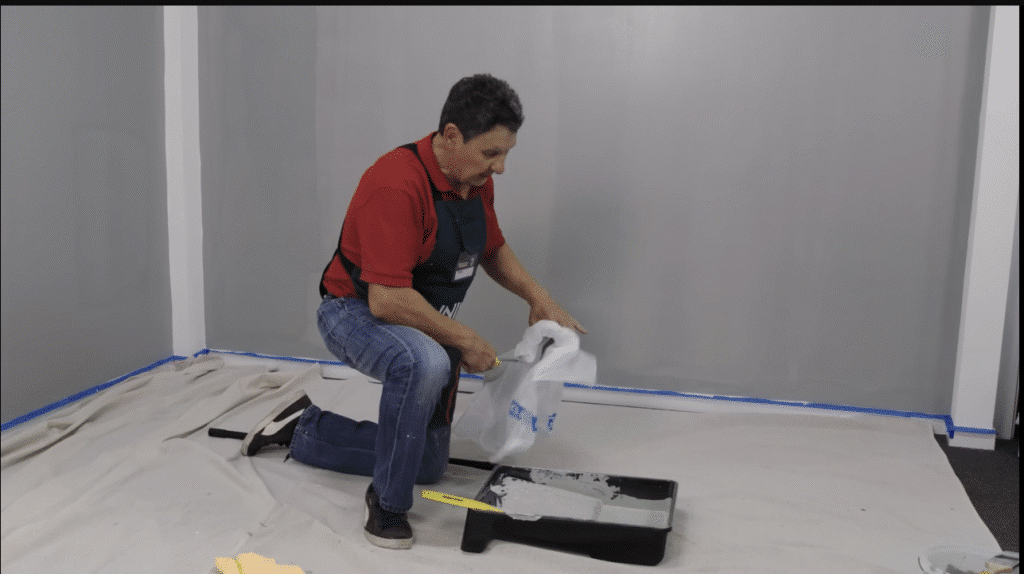 Painters using scaffolding on a multi-story building.