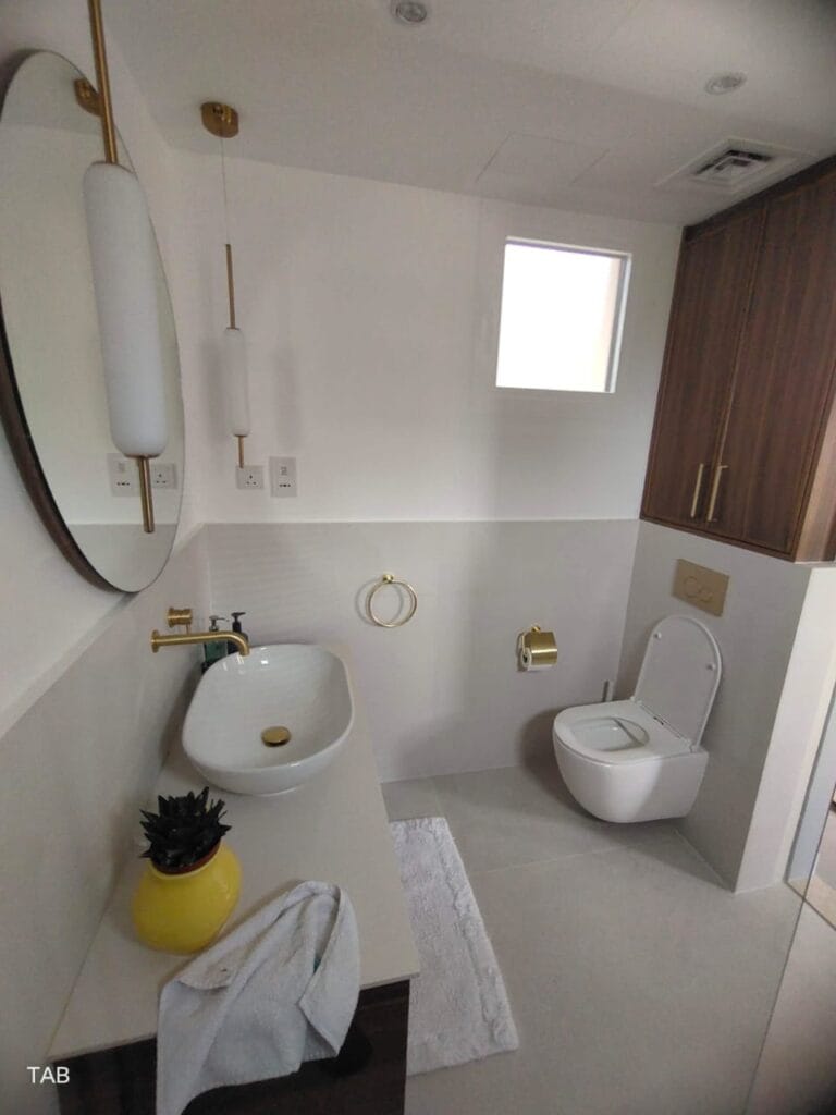 Traditional washroom with ceramic tiles and soft lighting